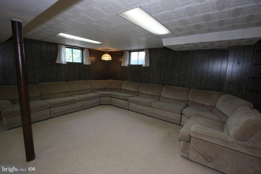 412 West Maple Road Linthicum Heights, MD 21090 - Photo 19 of 28 a living room with couches and a painting on the wall