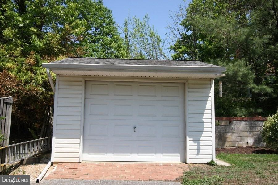 412 West Maple Road Linthicum Heights, MD 21090 - Photo 21 of 28 a small house with a tree in the grass