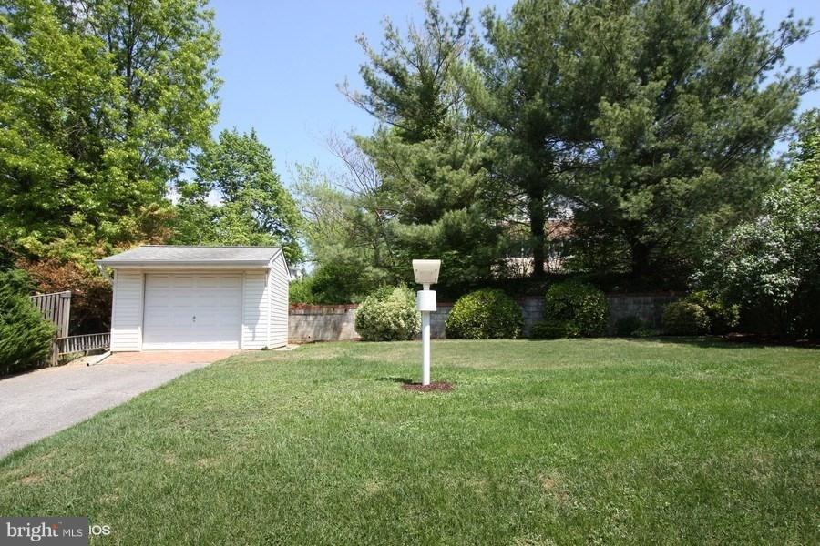 412 West Maple Road Linthicum Heights, MD 21090 - Photo 22 of 28 a house with a tree in front of it