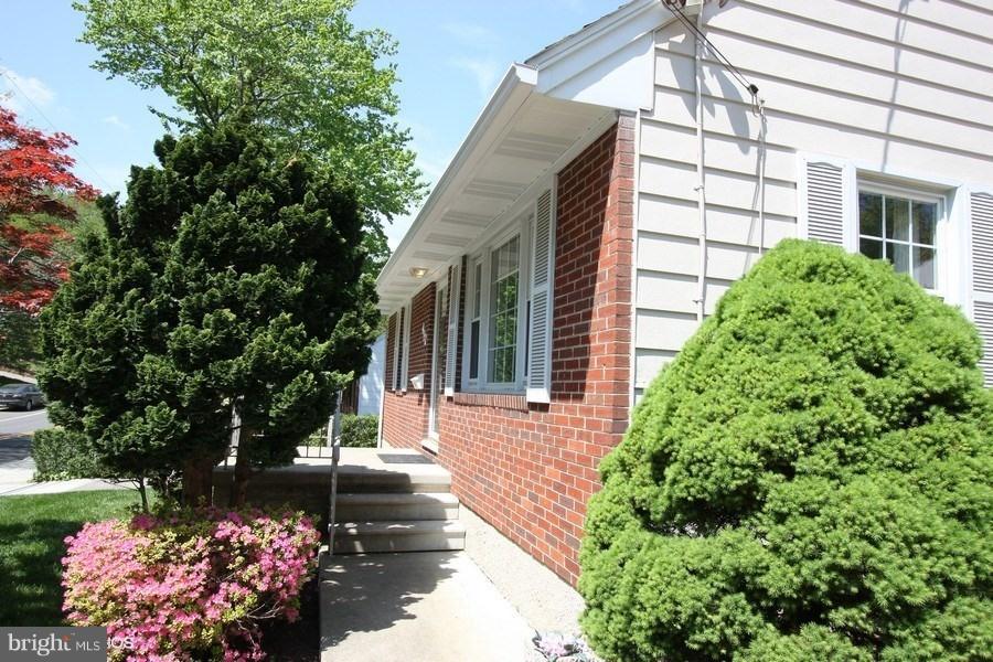412 West Maple Road Linthicum Heights, MD 21090 - Photo 26 of 28 a view of a house with a yard and garden