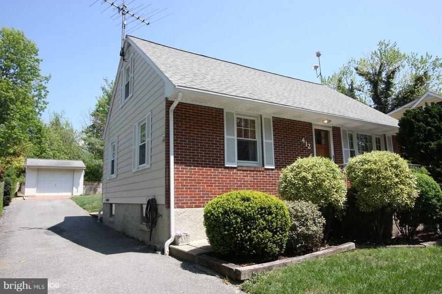 412 West Maple Road Linthicum Heights, MD 21090 - Photo 28 of 28 a front view of a house with garden
