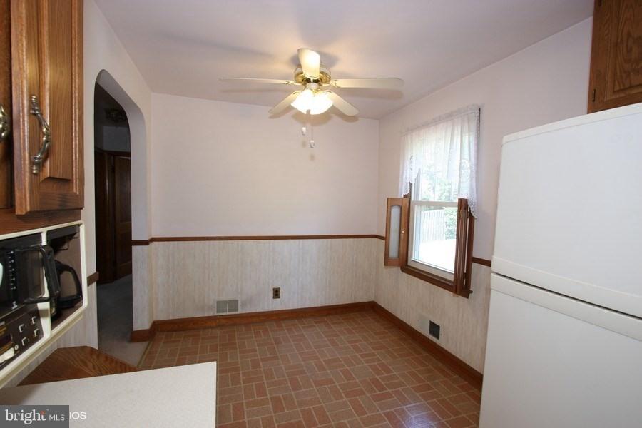 412 West Maple Road Linthicum Heights, MD 21090 - Photo 8 of 28 a view of a livingroom with a ceiling fan and window