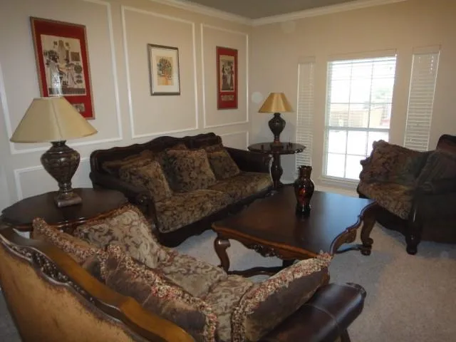 a view of a livingroom with a ceiling fan and window