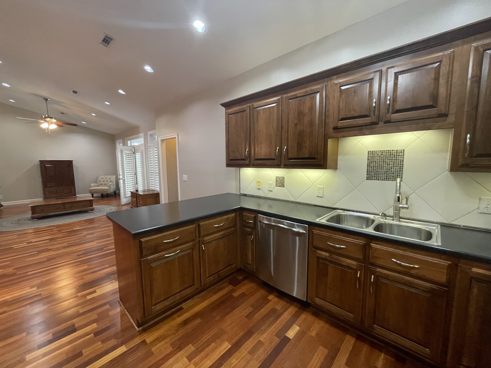 705 Blackpatch Drive, Unit 8 Springfield, TN 37172 - Photo 15 of 28 a kitchen with stainless steel appliances granite countertop a sink stove and cabinets