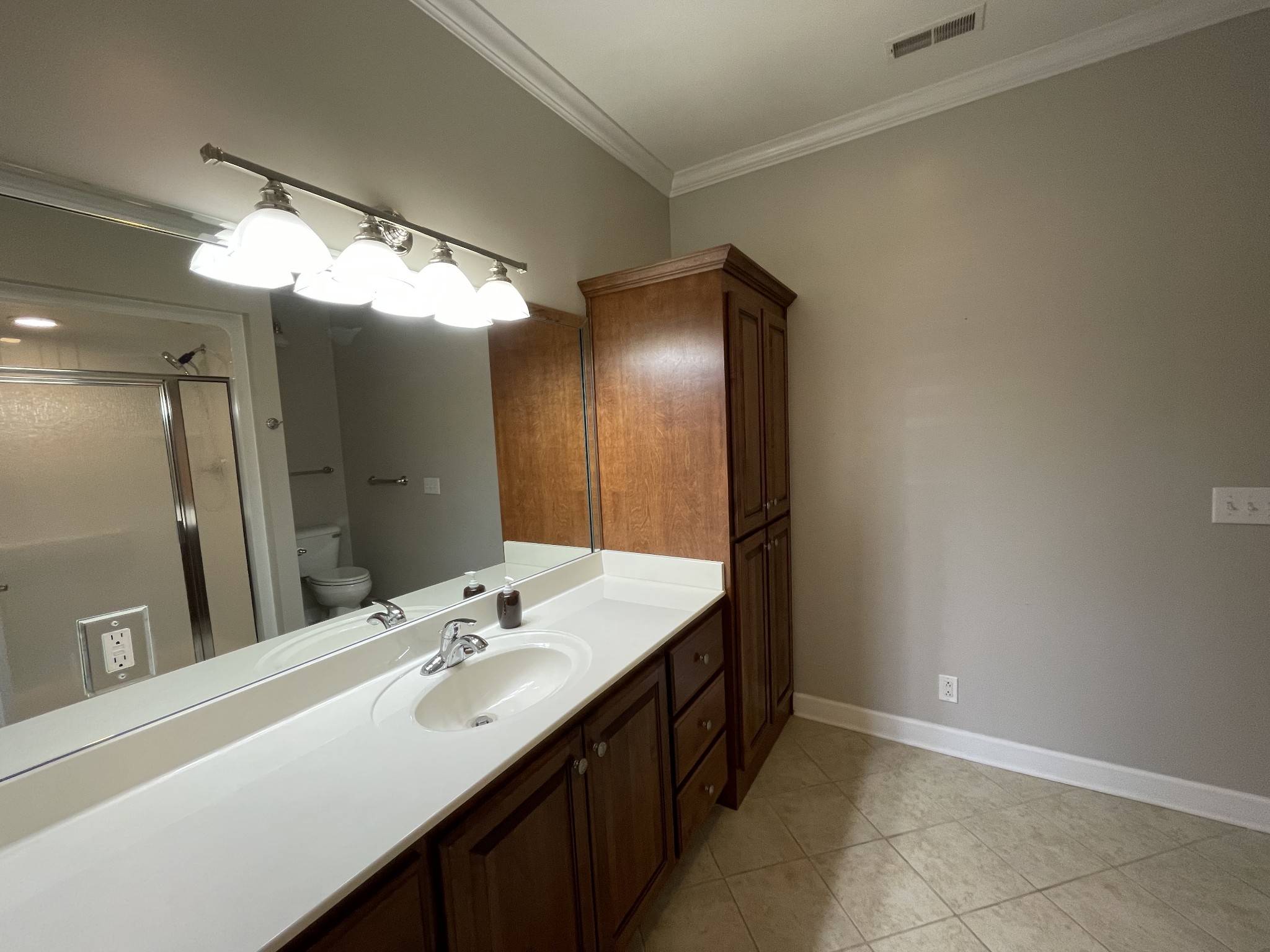 705 Blackpatch Drive, Unit 8 Springfield, TN 37172 - Photo 23 of 28 a bathroom with a double vanity sink and a mirror