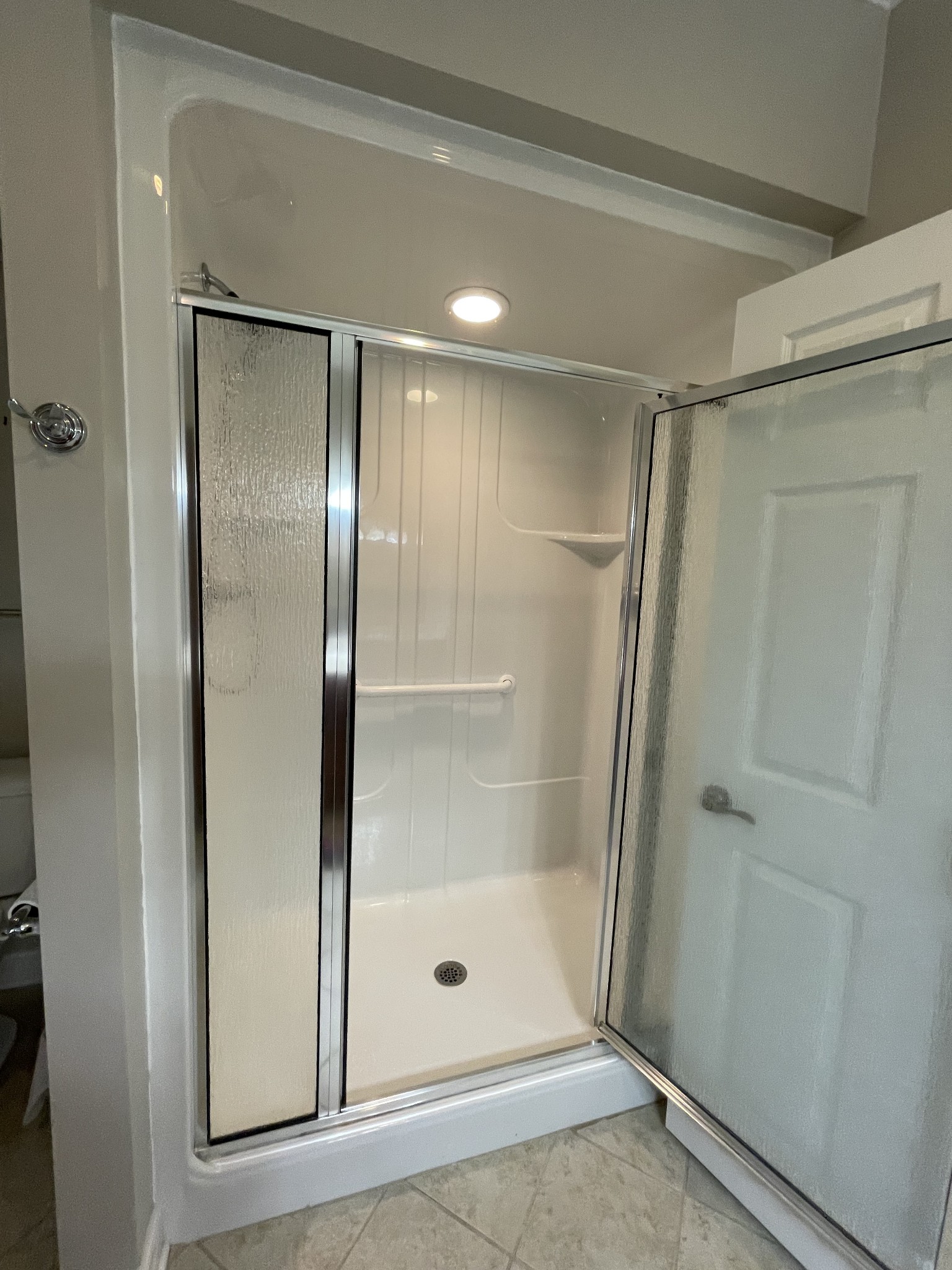 705 Blackpatch Drive, Unit 8 Springfield, TN 37172 - Photo 24 of 28 a bathroom with a glass shower door