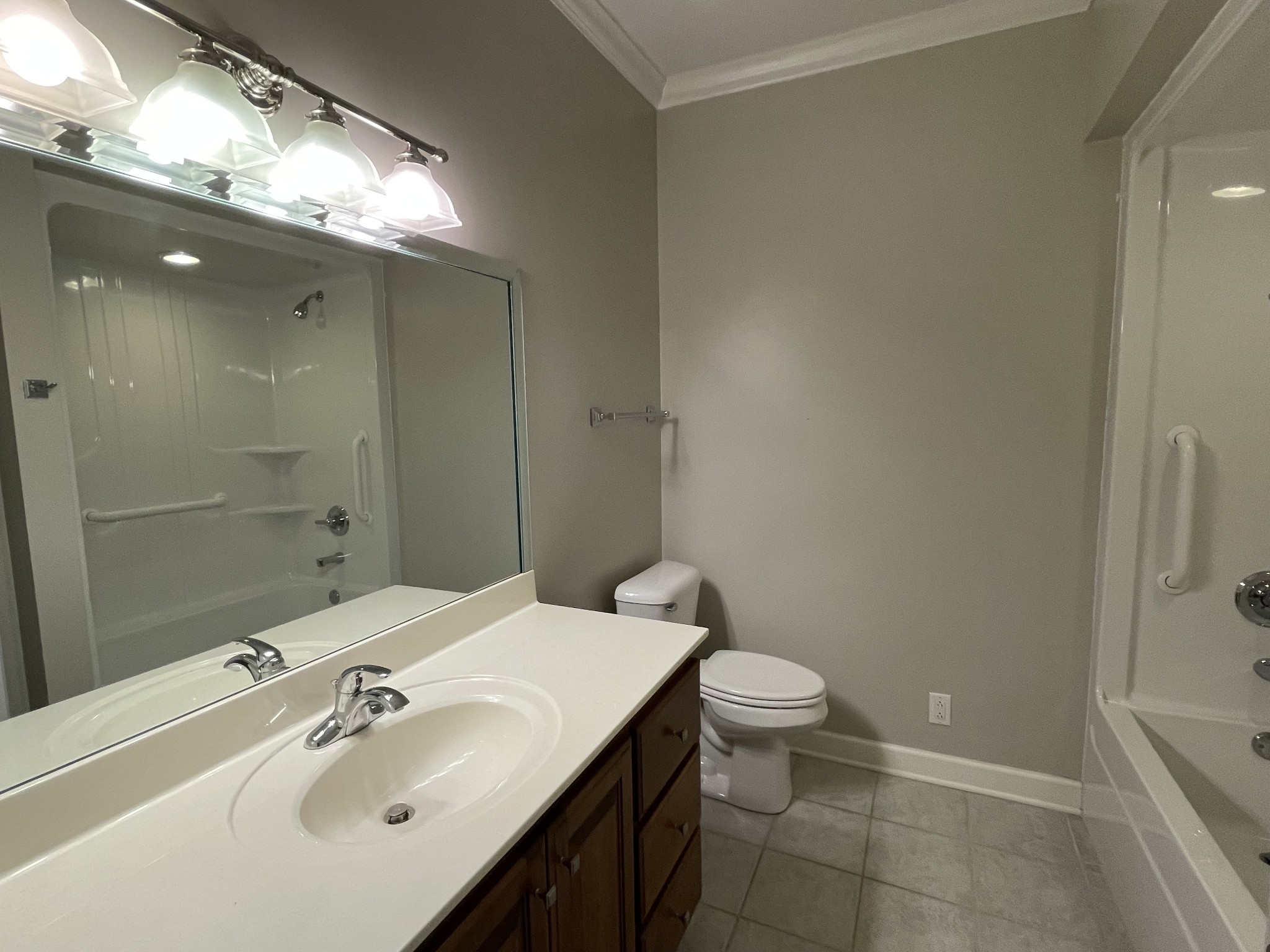 705 Blackpatch Drive, Unit 8 Springfield, TN 37172 - Photo 27 of 28 a bathroom with a sink a toilet a shower and a mirror