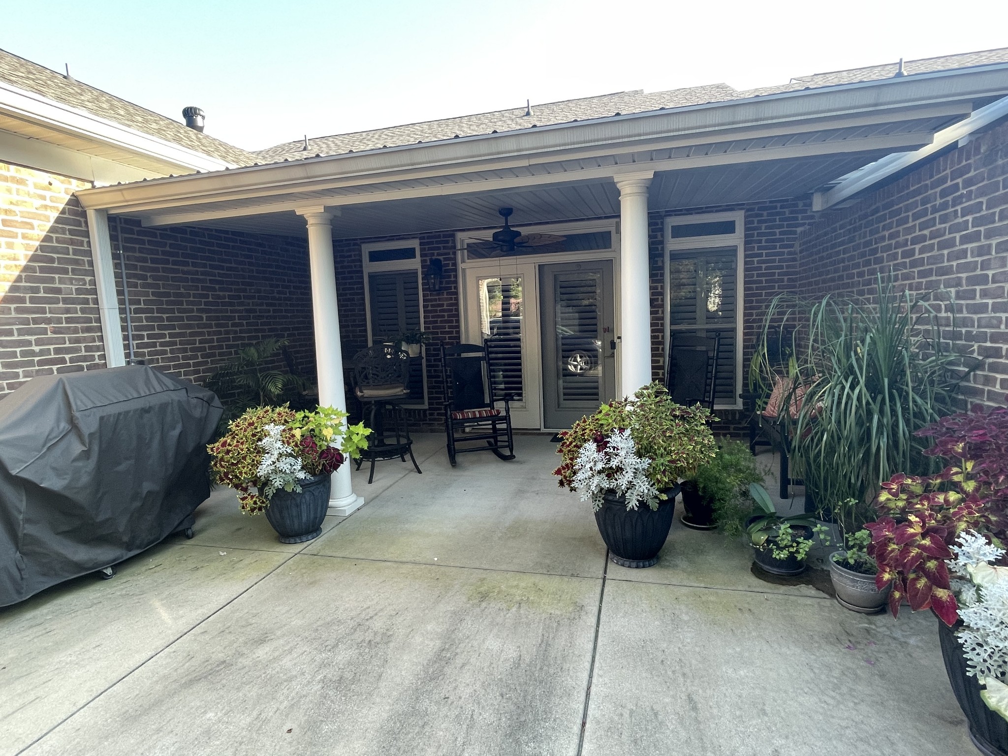 705 Blackpatch Drive, Unit 8 Springfield, TN 37172 - Photo 5 of 28 a front view of a house with outdoor seating and flowers