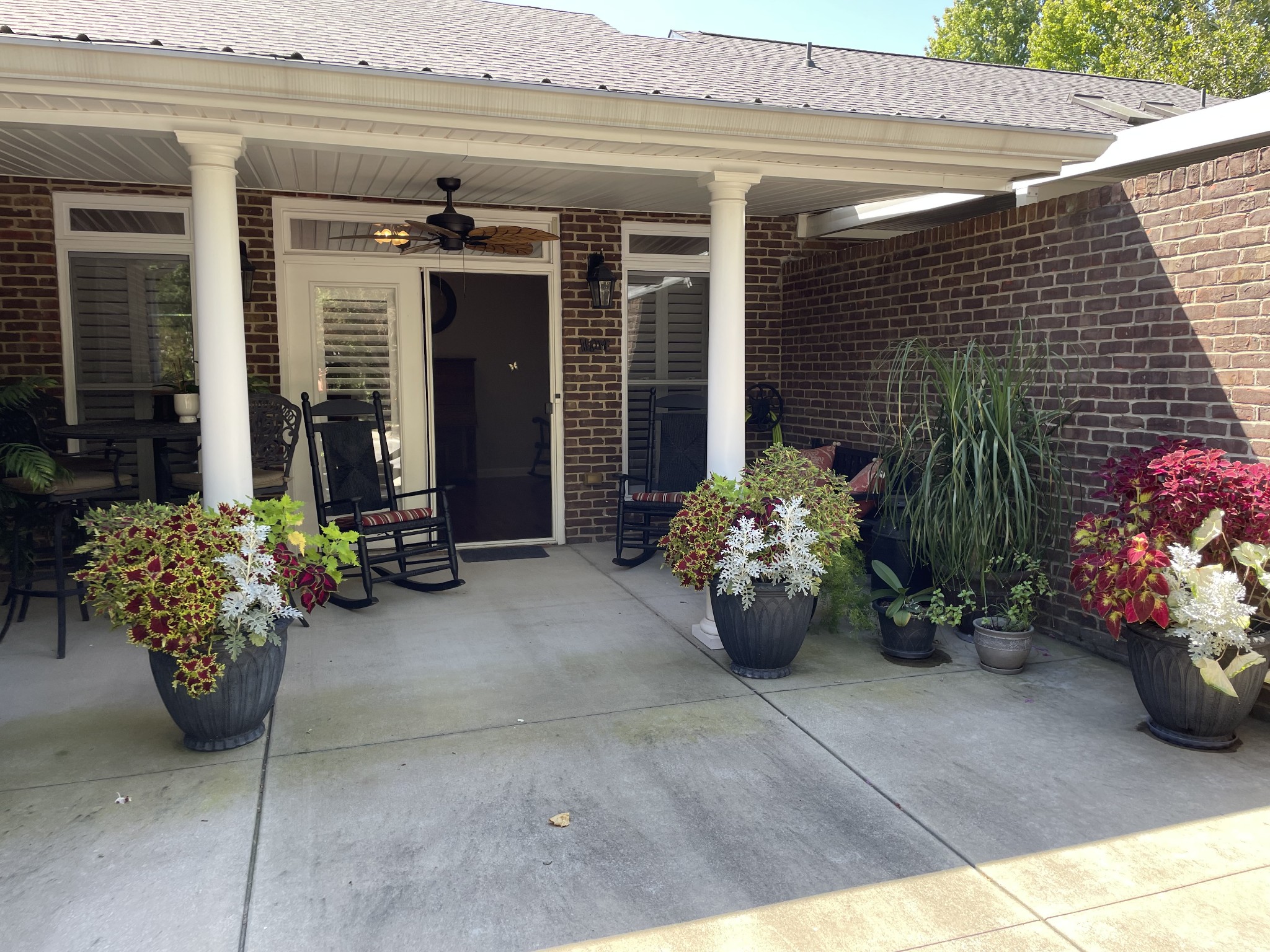 705 Blackpatch Drive, Unit 8 Springfield, TN 37172 - Photo 6 of 28 a view of a patio with two chairs and a potted plant