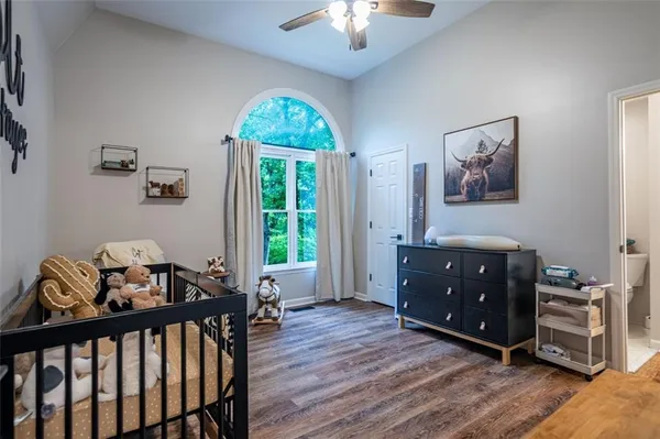 a bedroom with furniture and a window