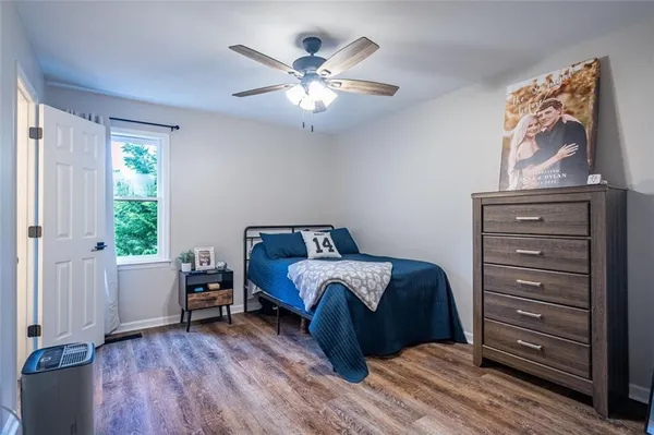 a bed room with a bed and a window