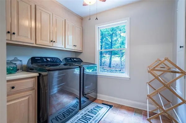 a kitchen with a window a sink and cabinets
