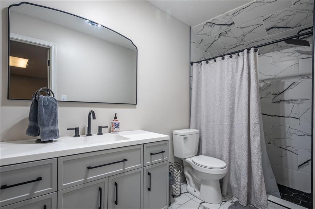 30 Westover Drive Southwest Rome, GA 30165 - Photo 33 of 51 a bathroom with a toilet sink and mirror