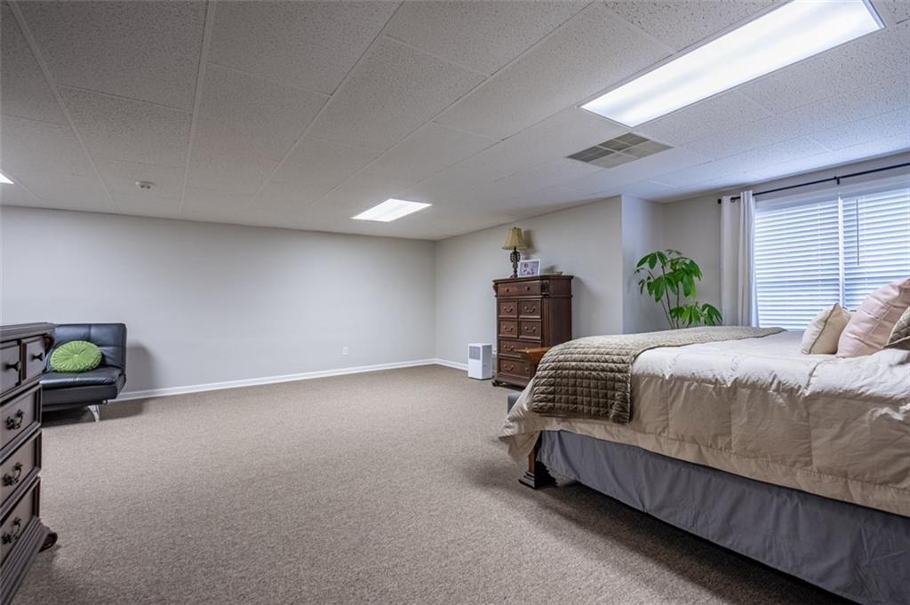30 Westover Drive Southwest Rome, GA 30165 - Photo 34 of 51 a bedroom with a bed and ceiling fan