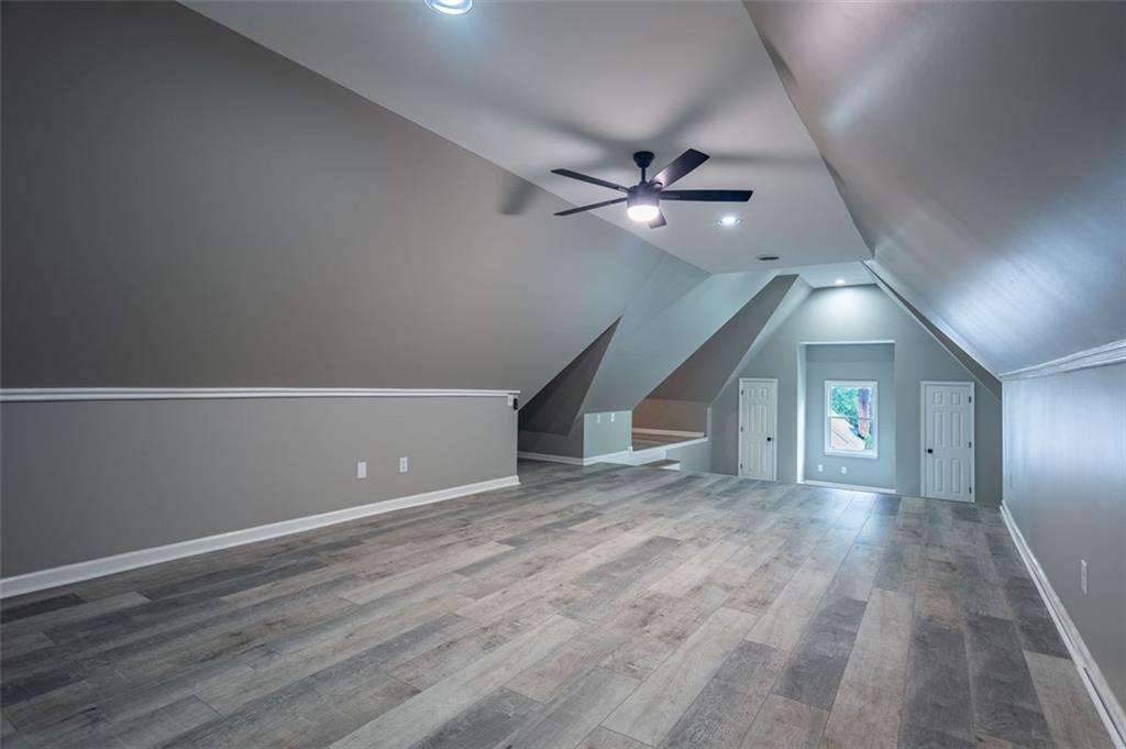 30 Westover Drive Southwest Rome, GA 30165 - Photo 38 of 51 an empty room with wooden floor fan and windows