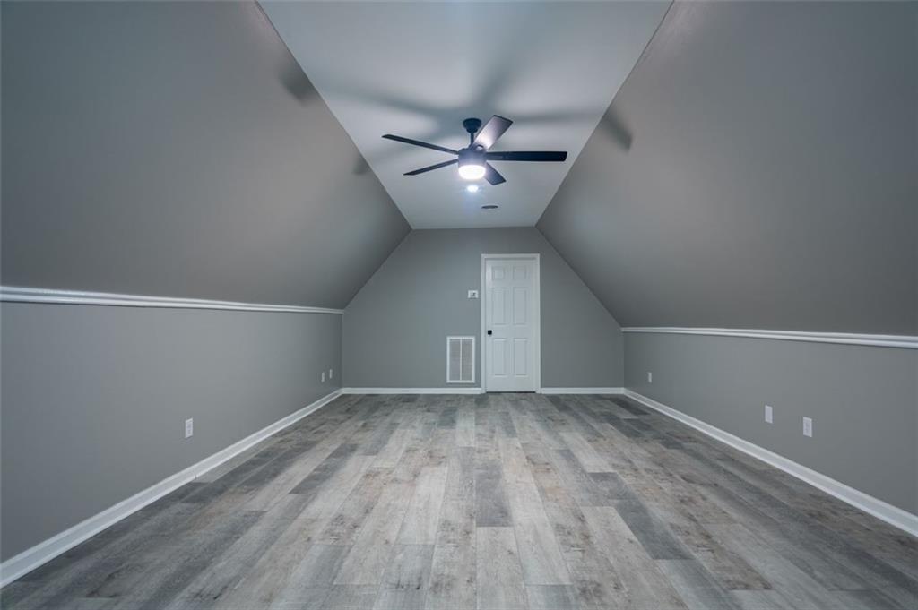 30 Westover Drive Southwest Rome, GA 30165 - Photo 39 of 51 an empty room with wooden floor and fan