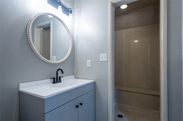 a bathroom with a sink and a mirror