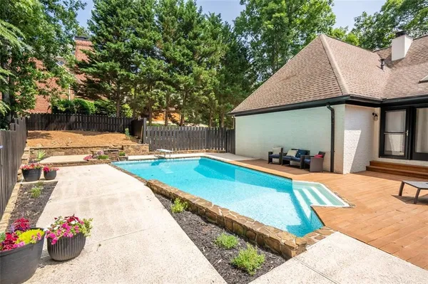 a view of a house with swimming pool