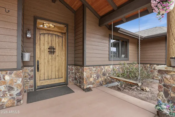 a view of porch with wooden floor