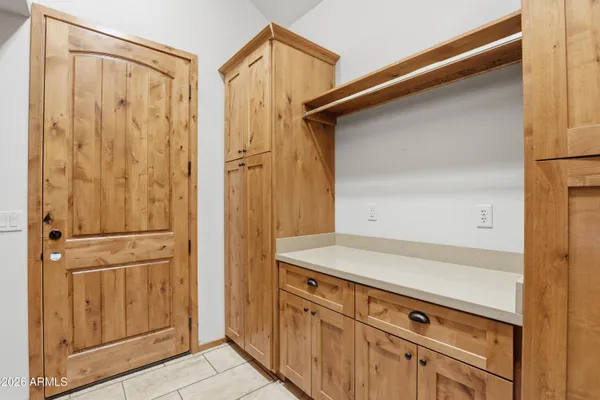 a bathroom with a granite countertop sink toilet and mirror
