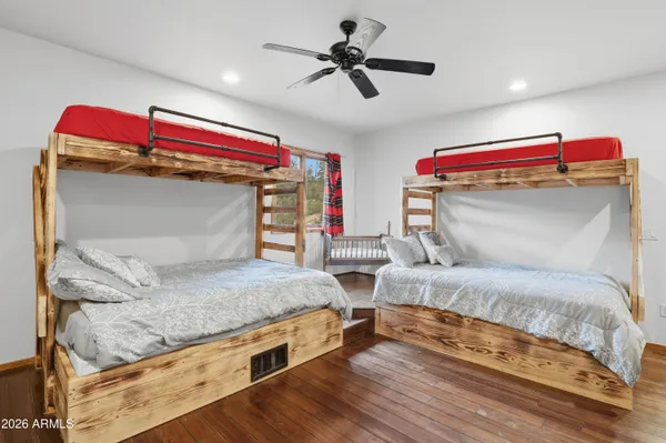 a bedroom with a bed and a large mirror
