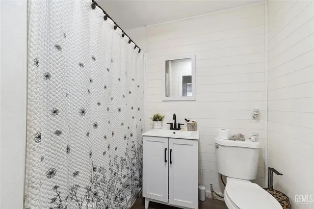 a bathroom with a toilet a sink and a shower