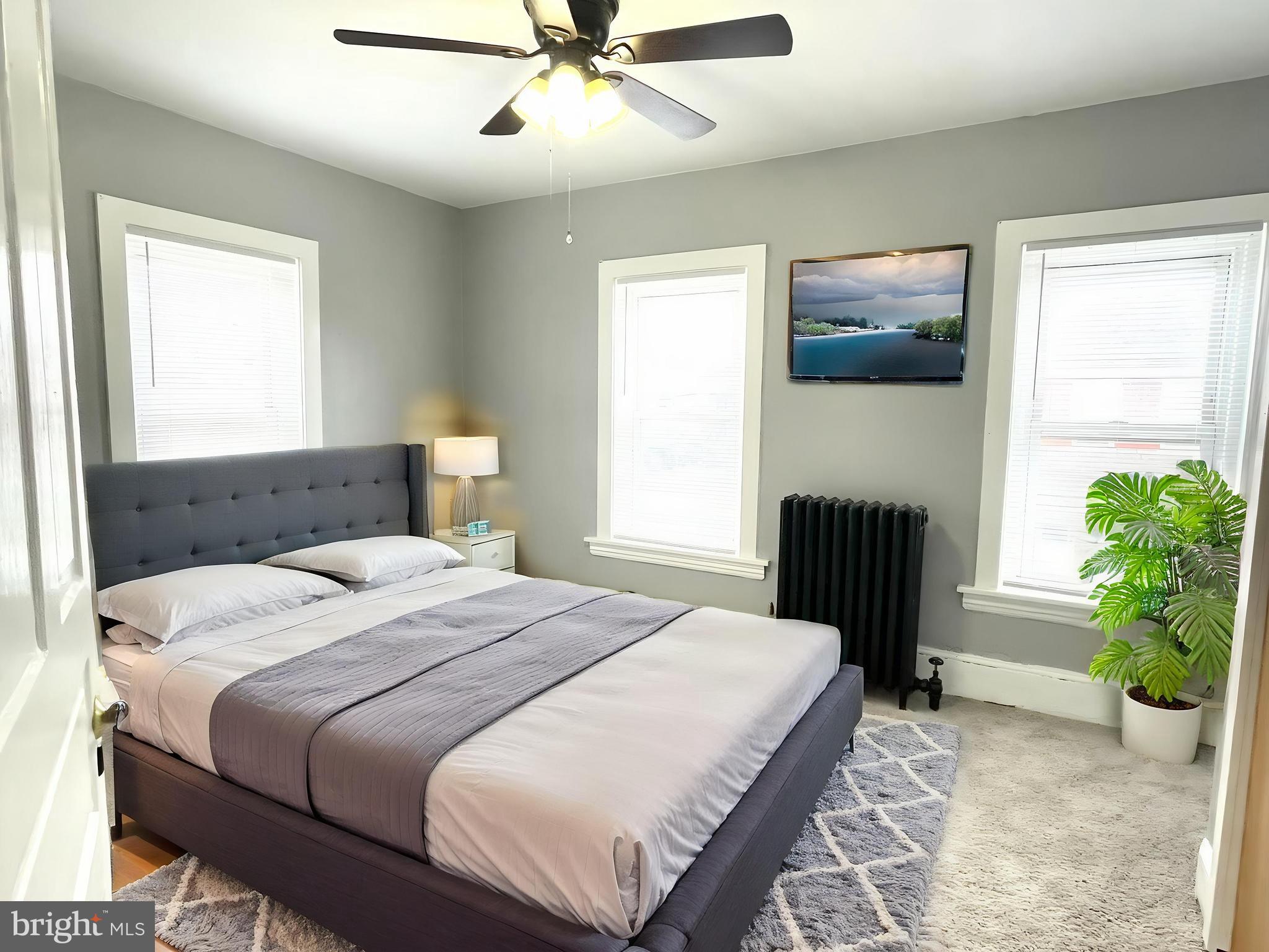 434 Pierce Street Lansdale, PA 19446 - Photo 16 of 28 a bedroom with a bed and a chandelier