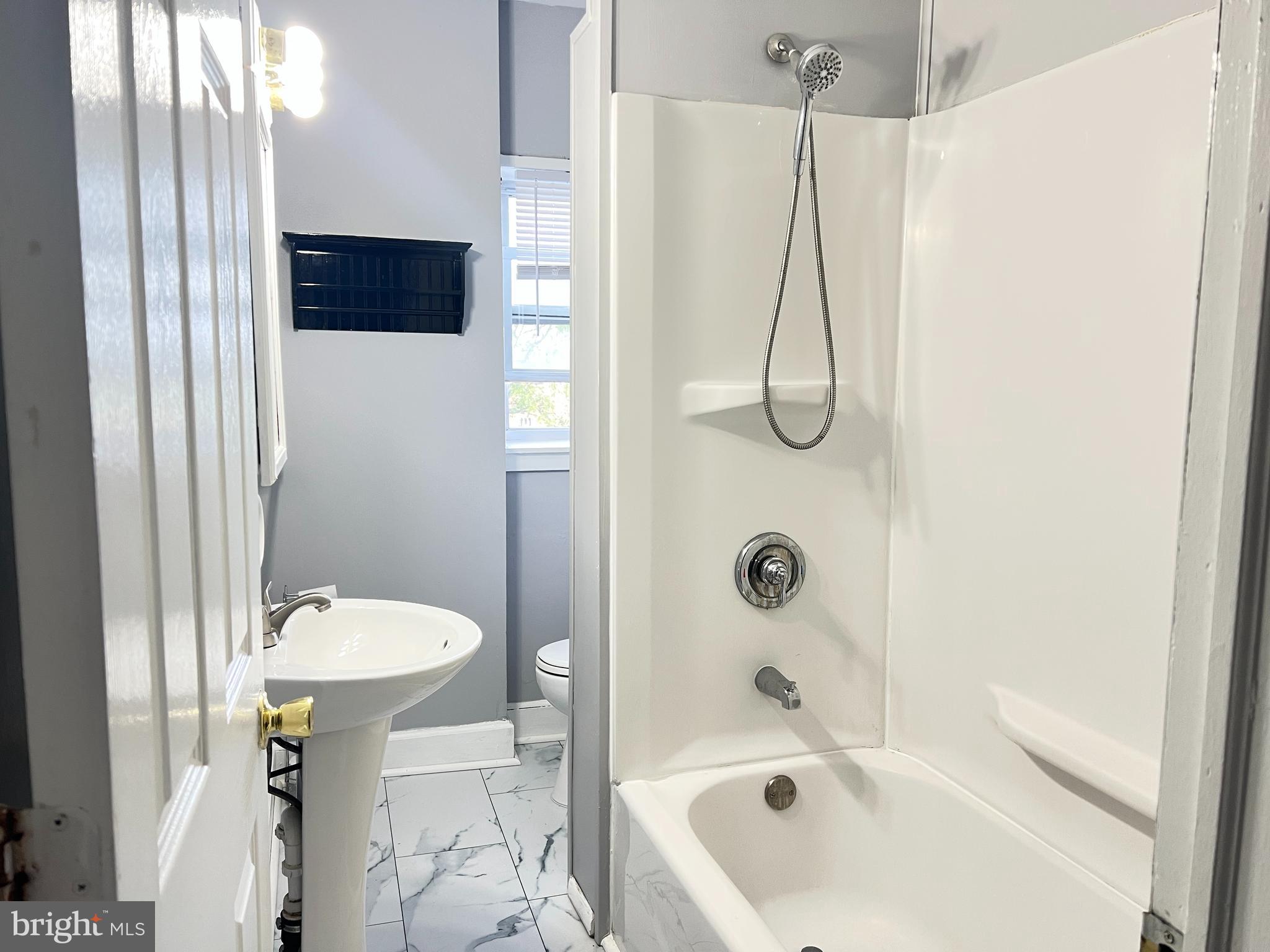 434 Pierce Street Lansdale, PA 19446 - Photo 19 of 28 a bathroom with a sink a toilet and shower