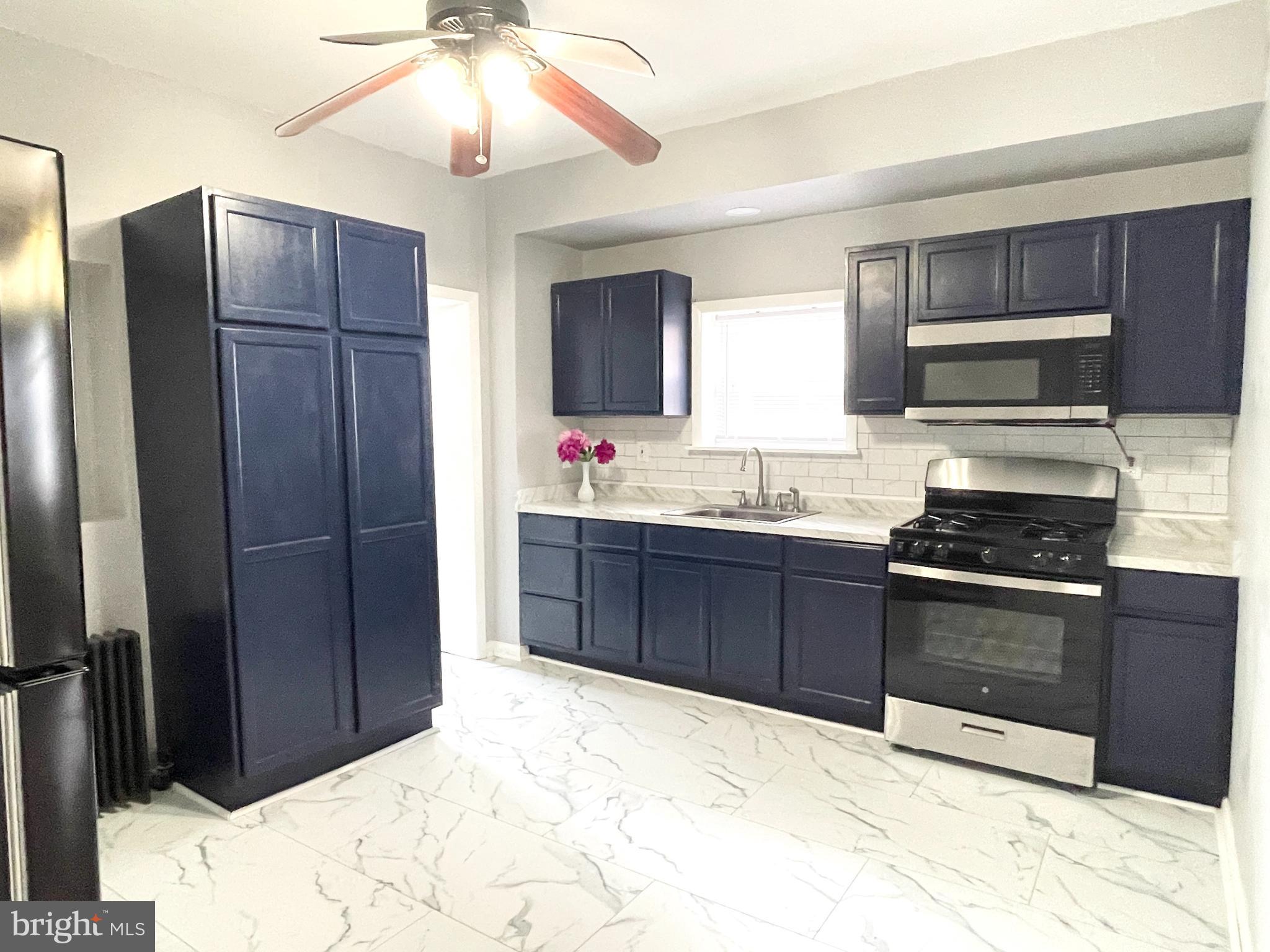 434 Pierce Street Lansdale, PA 19446 - Photo 8 of 28 a kitchen with stainless steel appliances granite countertop a refrigerator and a sink