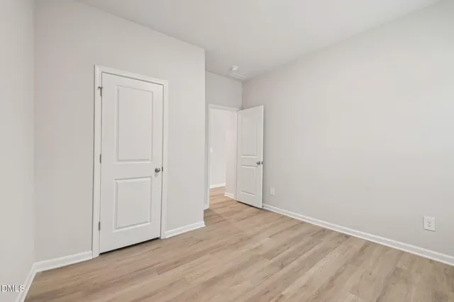 a view of an empty room and a window