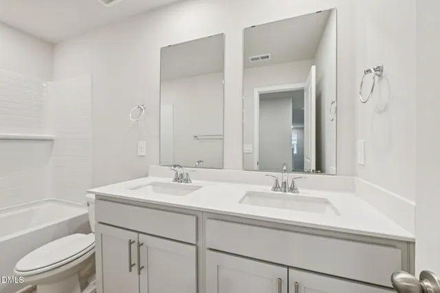 an outdoor view of a house with basket ball court