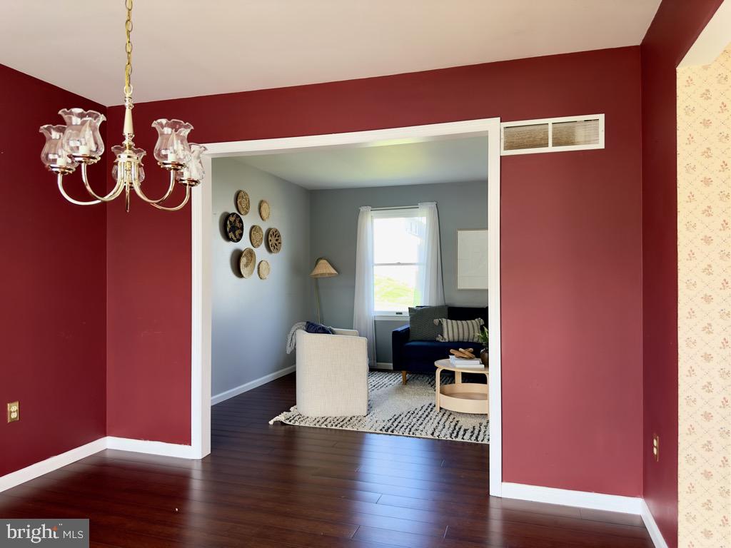 501 Deborah Drive Reading, PA 19608 - Photo 12 of 58 a view of a livingroom with furniture a dinning room and stairs