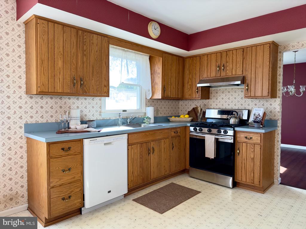 501 Deborah Drive Reading, PA 19608 - Photo 15 of 58 a kitchen with stainless steel appliances granite countertop a stove a sink dishwasher and a refrigerator