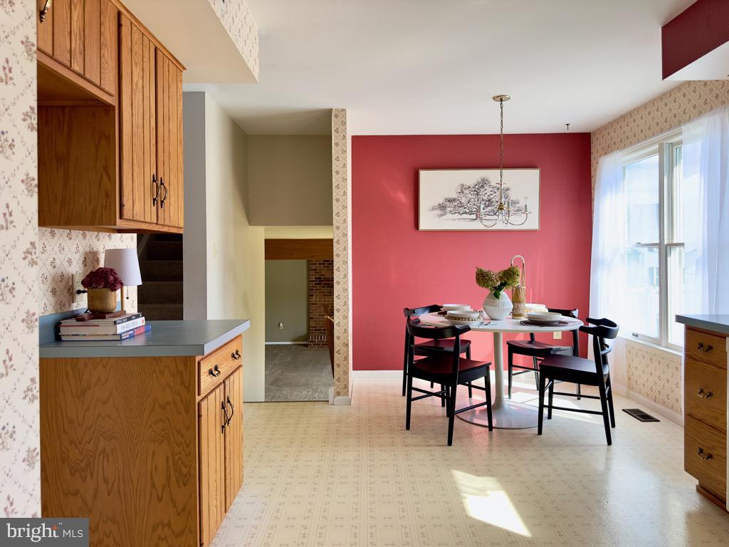 501 Deborah Drive Reading, PA 19608 - Photo 18 of 58 a view of a dining room with furniture and wooden floor