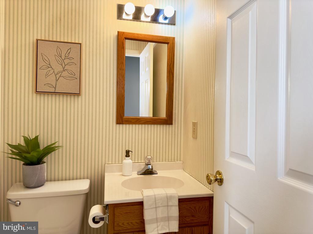 501 Deborah Drive Reading, PA 19608 - Photo 19 of 58 a bathroom with a toilet a sink and mirror