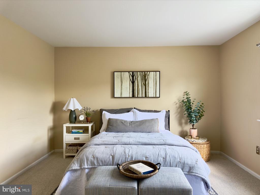 501 Deborah Drive Reading, PA 19608 - Photo 25 of 58 a bedroom with a bed and a potted plant