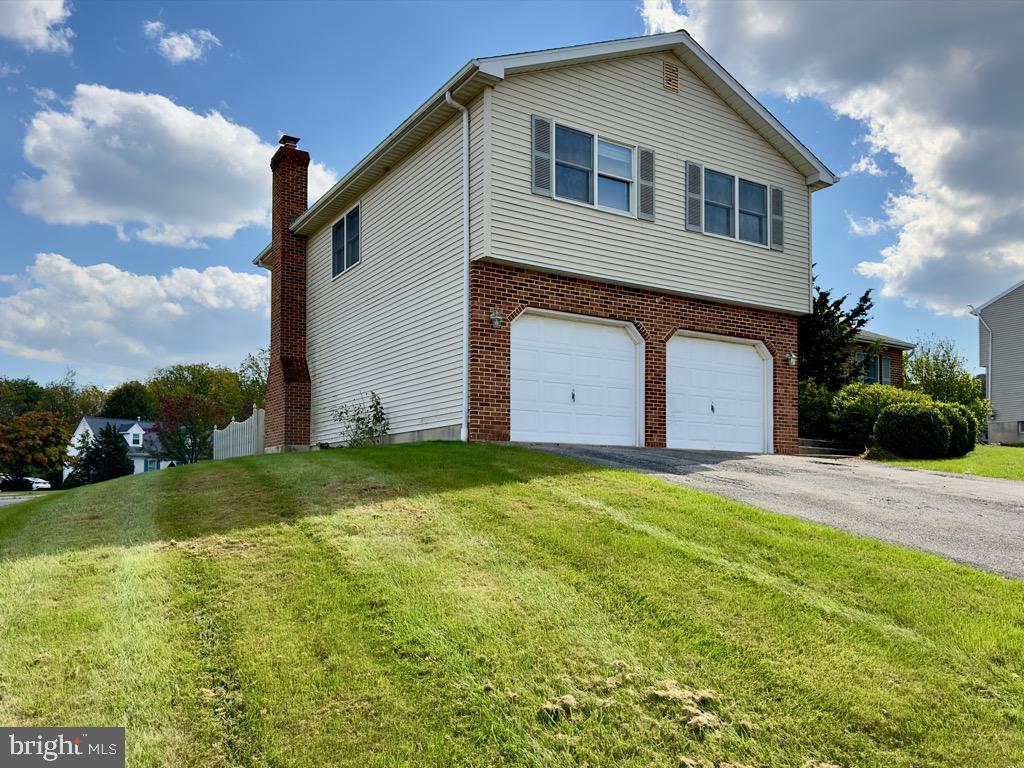 501 Deborah Drive Reading, PA 19608 - Photo 3 of 58 a front view of house with yard and green space
