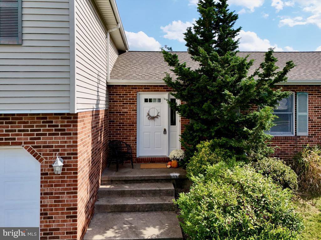 501 Deborah Drive Reading, PA 19608 - Photo 4 of 58 a front view of a house with a garden