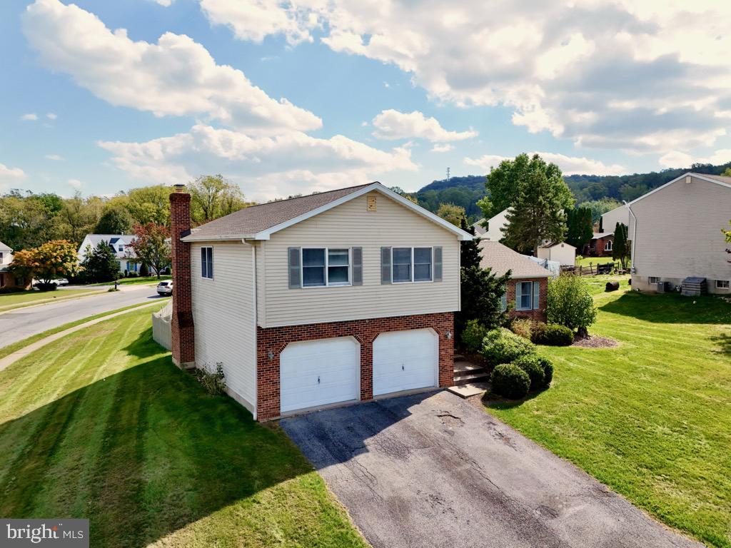 501 Deborah Drive Reading, PA 19608 - Photo 57 of 58 a aerial view of a house with swimming pool and a yard