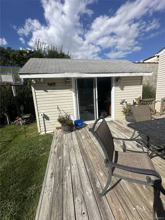 a view of a backyard with sitting area