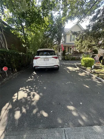 a car parked in front of a house