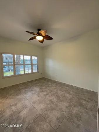 a view of an empty room with a window