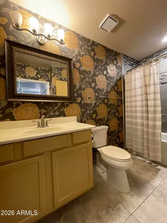 a view of a hallway with wooden shelves