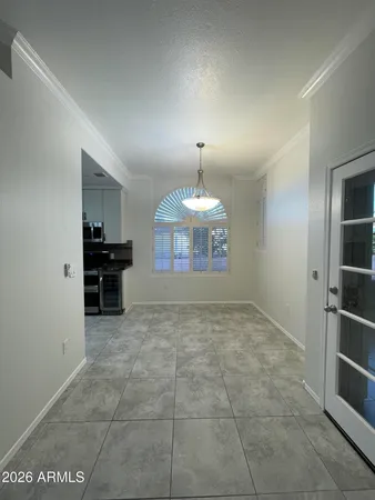 a view of a kitchen with a sink and a refrigerator