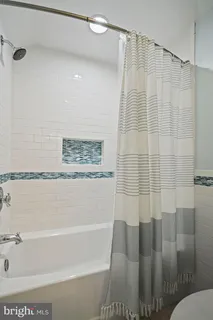 a bathroom with a shower and a bathtub