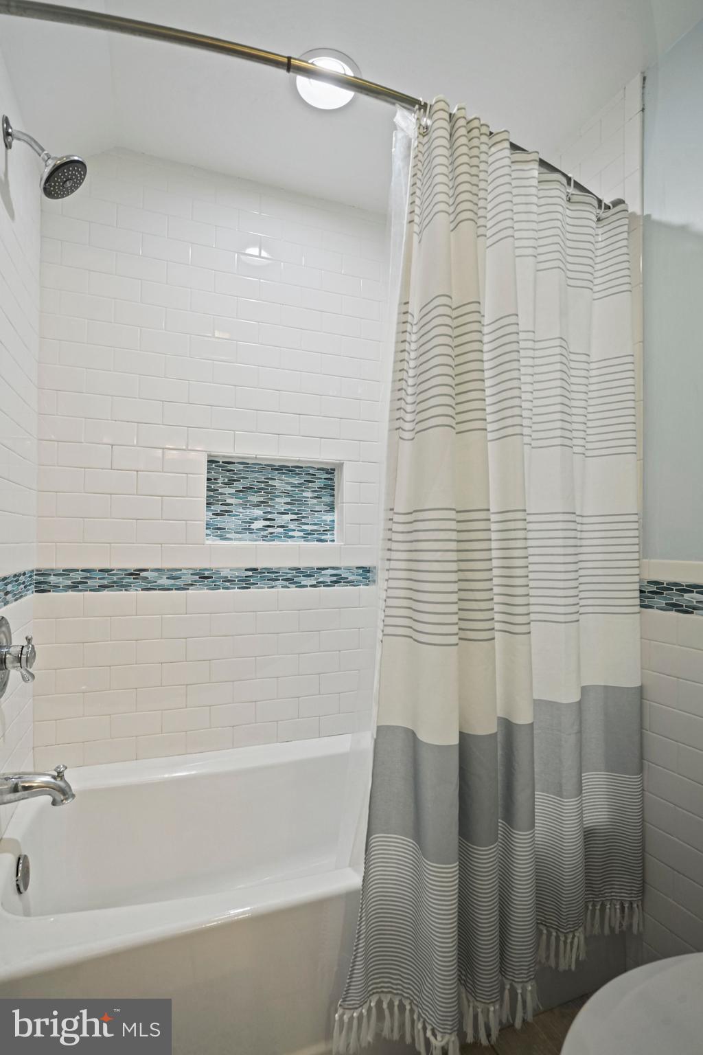 1907 Brisbane Street Silver Spring, MD 20902 - Photo 29 of 39 a bathroom with a shower and a bathtub