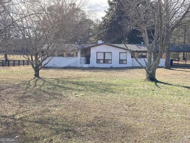 7035 Hobgood Road Fairburn, GA 30213 - Photo 1 of 1 a large tree in front of a house with a large tree