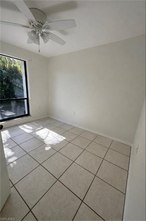 1228 Commonwealth Circle, Unit O203 Naples, FL 34116 - Photo 6 of 17 a view of empty room with window