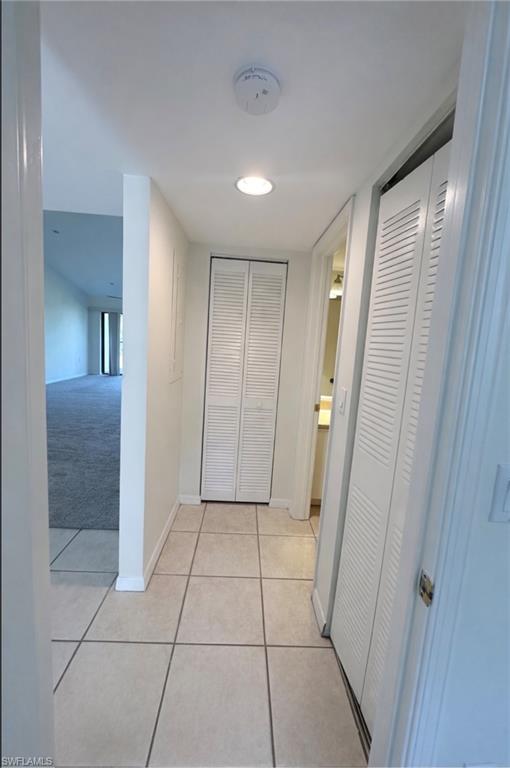 1228 Commonwealth Circle, Unit O203 Naples, FL 34116 - Photo 7 of 17 a view of a hallway