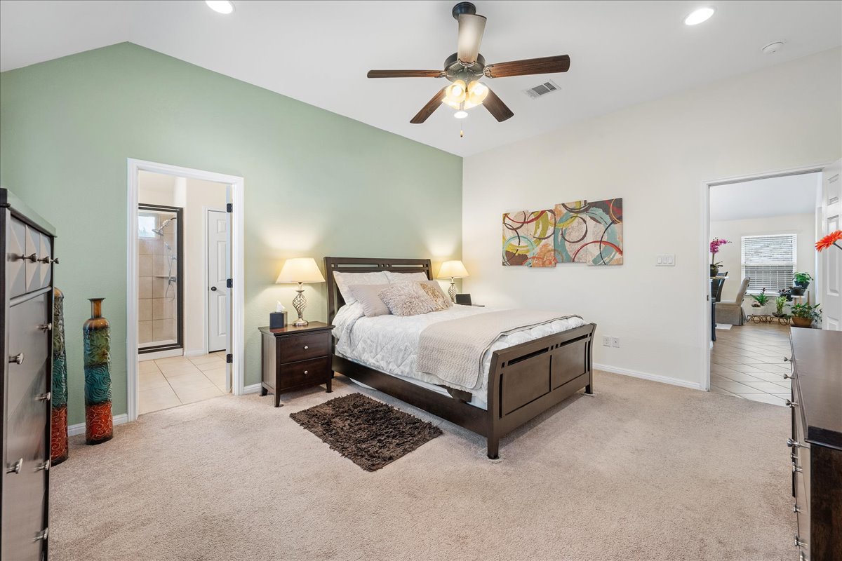 3000 Rio Verde Drive Leander, TX 78641 - Photo 11 of 23 a bedroom with a bed and a chandelier